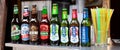 Simple row of Polish beer bottles, set, various brands, many different alcohol bottles and plastic straws. ÃÂ»ubr, LeÃÂ¼ajsk...